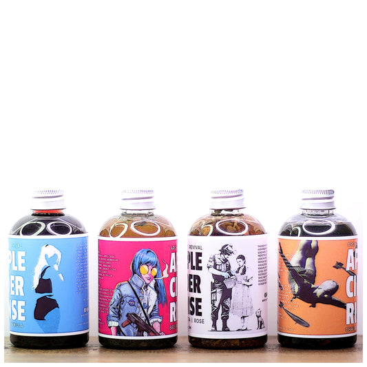 Wide shot of 4 different bottles of Apple Cider Hair Rinses by Archaic Revival. 